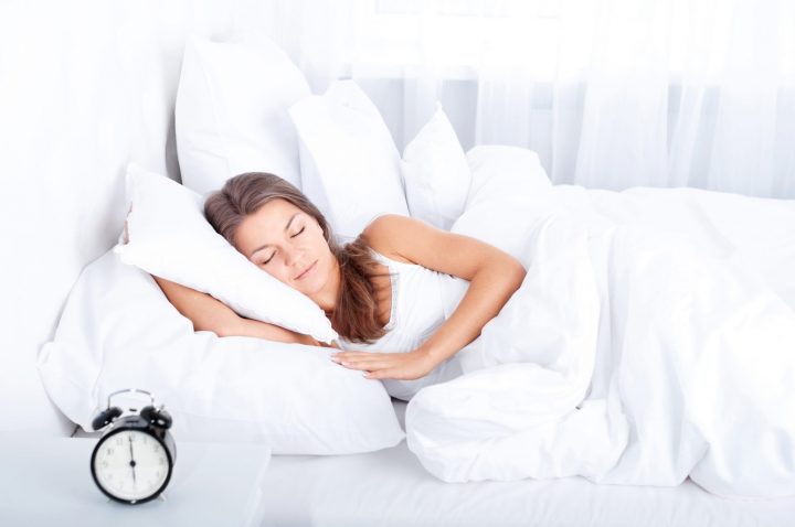 Woman sleeping in bed mattress store in Dubai